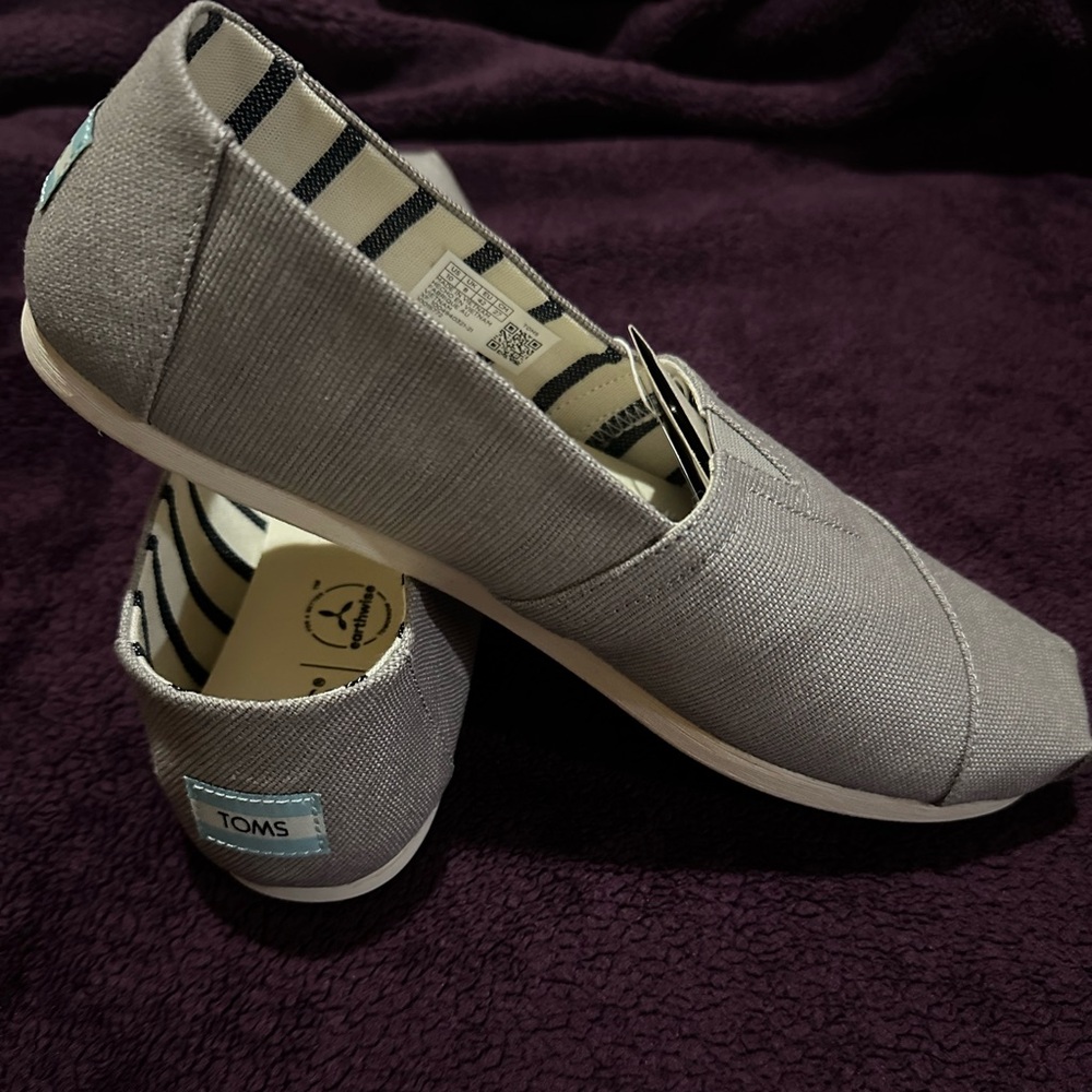 Light gray Toms brand new with tags six 10